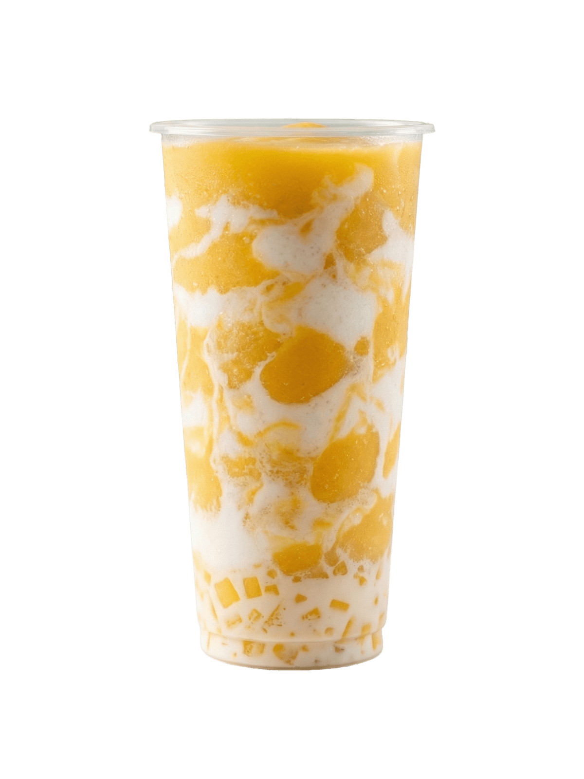 Tall glass of mango slush with visible chunks of fresh mango and pale coconut layers underneath